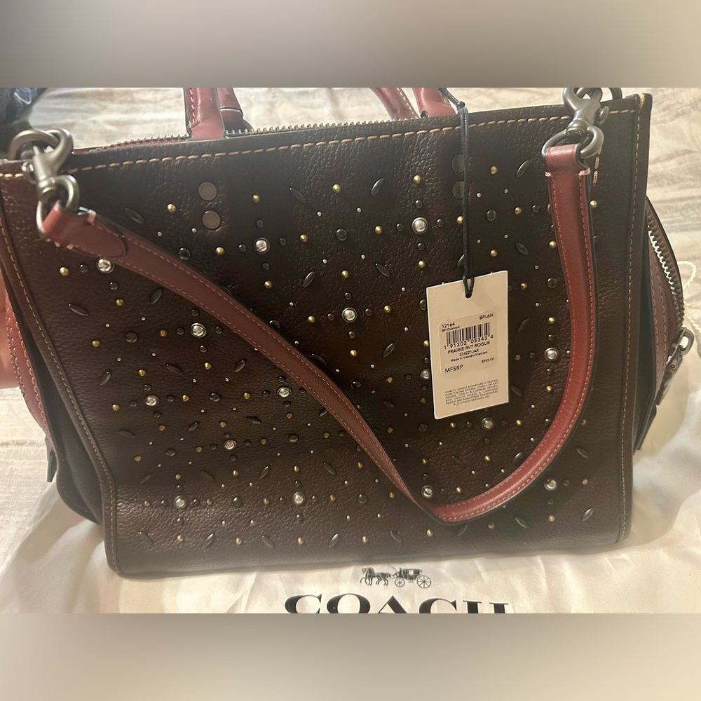 PRAIRIE RVT ROGUE- 
Coach Dark Brown Studded Satchel